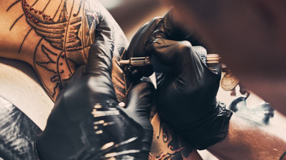 Arm being tattooed