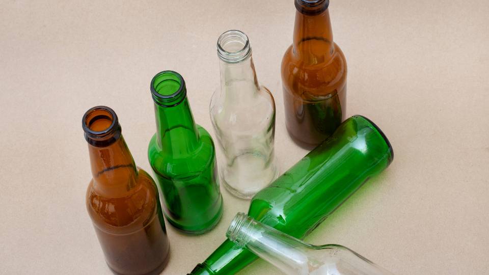 Green, brown, and clear glass bottles