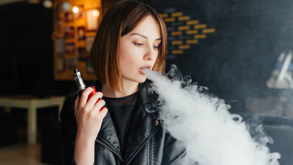 girl smoking a vape