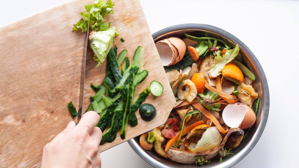 food waste scraping food into bin