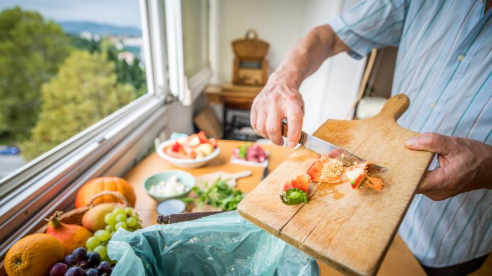 food waste scraped into bin