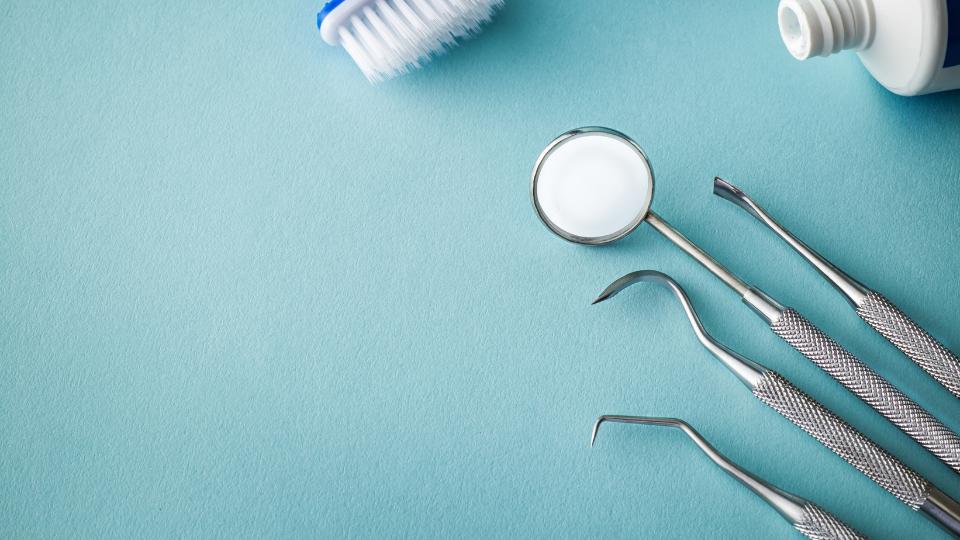 A photograph of dental tools that may need to go into sharps waste bins