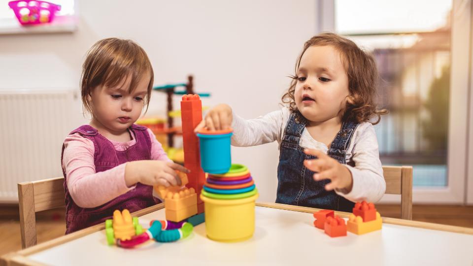 two children playing at a nursery
