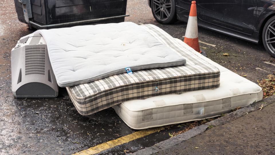 Fly tipped mattress on the road