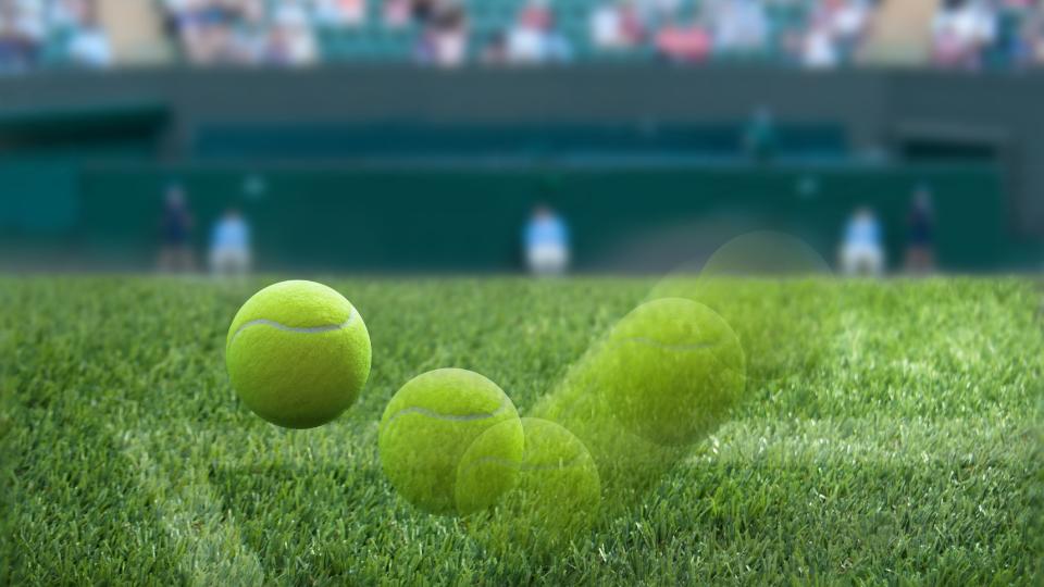 Tennis ball bouncing off the court at Wimbledon