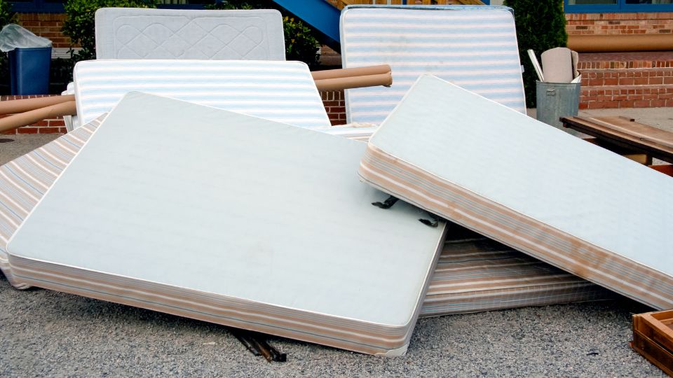 Mattresses being disposed of