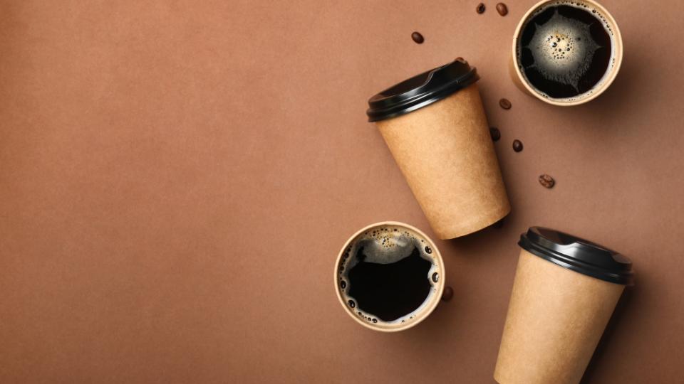 Coffee cups on a brown background