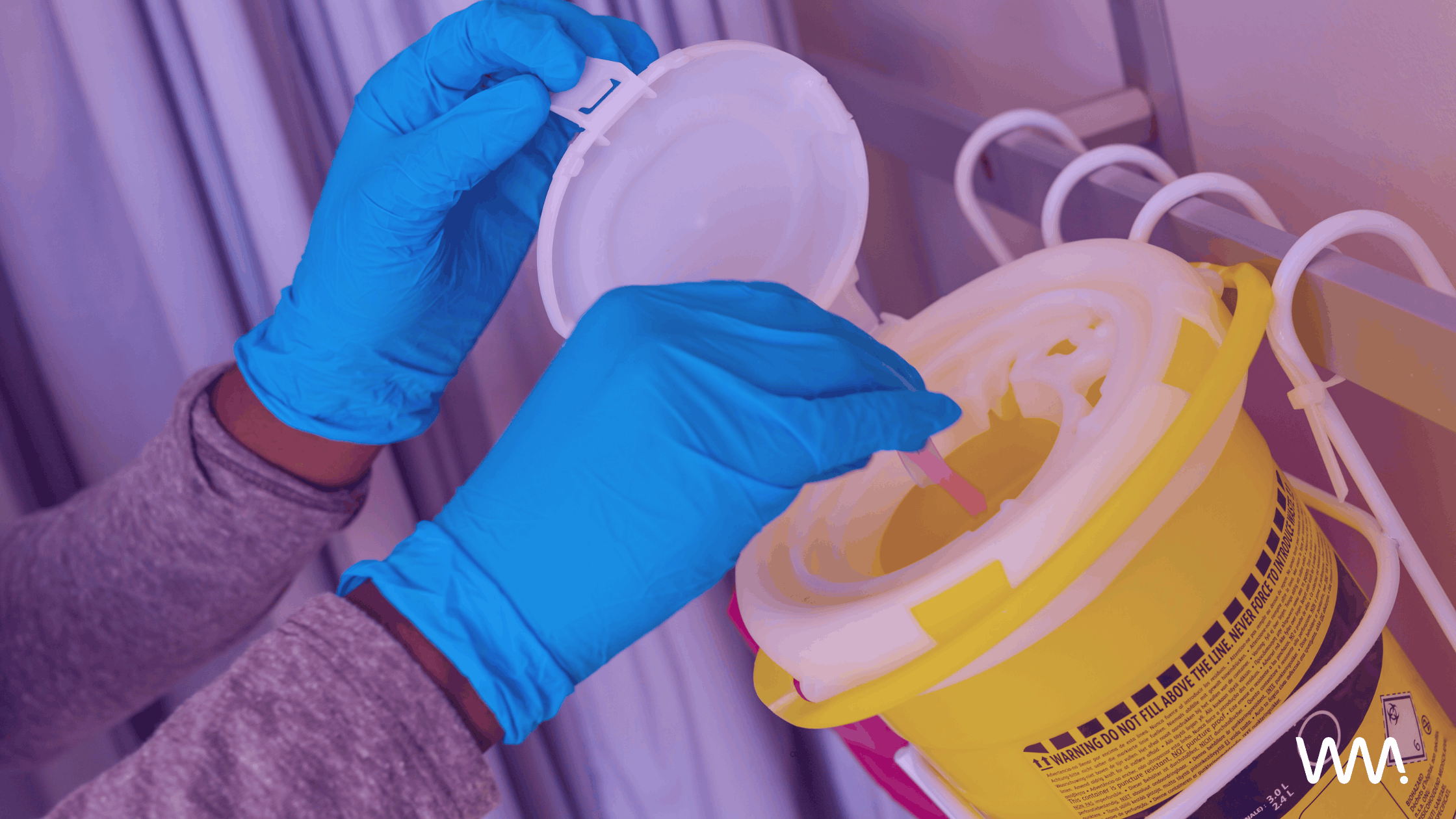 needles in sharps waste bin