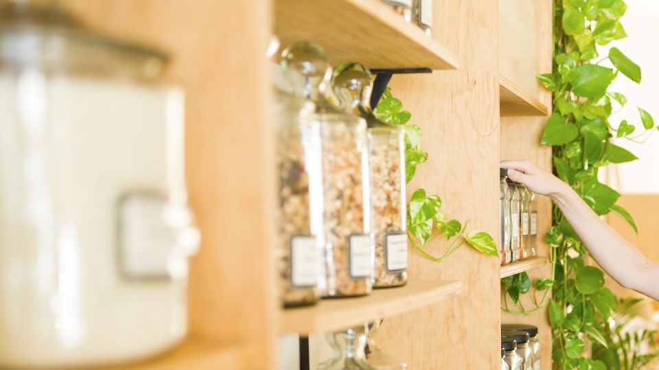 photo of reusable containers holding bakery items like nuts and flour