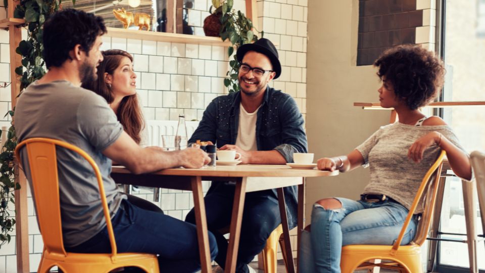 people in a bakery eating pastries and drinking coffee discussing zero waste